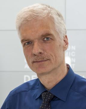 photograph of Andreas Schleicher in a blue shirt